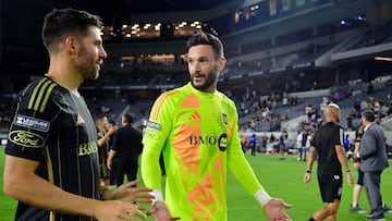 Aug 21, 2024; Los Angeles, California, USA; LAFC defender Ryan Hollingshead (24) talks with goalkeeper Hugo Lloris (1) after their win against the Colorado Rapids in a Leagues Cup semifinal match at BMO Stadium. Mandatory Credit: Gary A. Vasquez-USA TODAY Sports