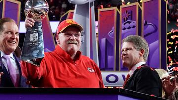 Kansas City Chiefs' head coach Andy Reid holds the trophy next to Kansas City Chiefs' owner, chairman and CEO Clark Hunt as they celebrate winning Super Bowl LVIII against the San Francisco 49ers at Allegiant Stadium in Las Vegas, Nevada, February 11, 2024. (Photo by TIMOTHY A. CLARY / AFP)