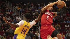 Mar 9, 2022; Houston, Texas, USA;  Houston Rockets forward Kenyon Martin Jr. (6) grabs a rebound against Los Angeles Lakers forward Stanley Johnson (14) in second half at Toyota Center. Houston Rockets won 139 to 130. Mandatory Credit: Thomas Shea-USA TOD