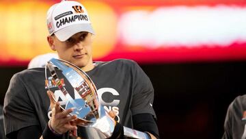 Jan 30, 2022; Kansas City, MO, USA; Cincinnati Bengals quarterback Joe Burrow (9) holds the AFC Championship trophy after the AFC championship NFL football game, Sunday, Jan. 30, 2022, at GEHA Field at Arrowhead Stadium in Kansas City, Mo. Mandatory Cre
