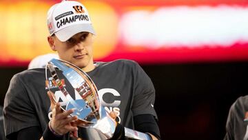 Jan 30, 2022; Kansas City, MO, USA;  Cincinnati Bengals quarterback Joe Burrow (9) holds the AFC Championship trophy after the AFC championship NFL football game, Sunday, Jan. 30, 2022, at GEHA Field at Arrowhead Stadium in Kansas City, Mo.  Mandatory Cre