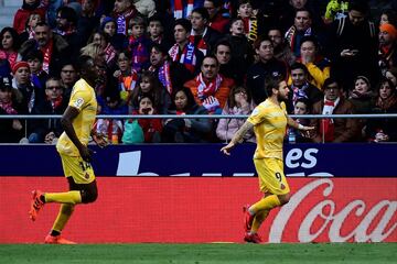 Cristian 'Portu' Portugués celebrates with teammates after scoring a goal.