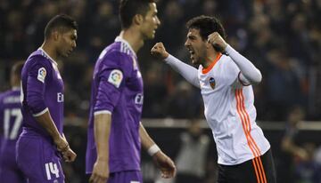 Casemiro (left) and Cristiano Ronaldo (centre) react as Dani Parejo (right) celebrates Valencia's win.