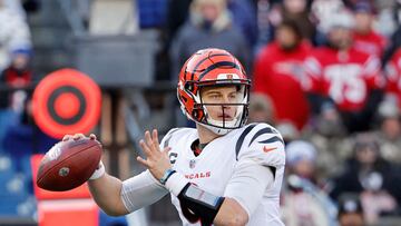 FOXBOROUGH, MASSACHUSETTS - DECEMBER 24: Joe Burrow #9 of the Cincinnati Bengals attempts a pass during the second quarter against the New England Patriots at Gillette Stadium on December 24, 2022 in Foxborough, Massachusetts.   Winslow Townson/Getty Images/AFP (Photo by Winslow Townson / GETTY IMAGES NORTH AMERICA / Getty Images via AFP)