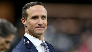 Nov 25, 2021; New Orleans, Louisiana, USA; Former New Orleans Saints quarterback Drew Brees stands on the sidelines before the game between the New Orleans Saints and the Buffalo Bills at the Caesars Superdome. Brees is b being honored at half-time of the