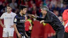 Real Sociedad's Spanish coach Imanol Alguacil (R) talks with Real Sociedad's Japanese forward Takefusa Kubo during the Spanish league football match between Sevilla FC and Real Sociedad at the Ramon Sanchez Pizjuan stadium in Seville on November 9, 2022. (Photo by CRISTINA QUICLER / AFP) (Photo by CRISTINA QUICLER/AFP via Getty Images)