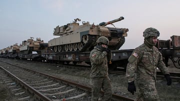 FILE PHOTO: US soldiers walk next to M1 Abrams tanks at the Mihail Kogalniceanu Air Base, Romania, February 14, 2017. Inquam Photos/Octav Ganea/via REUTERS ATTENTION EDITORS - THIS IMAGE WAS PROVIDED BY A THIRD PARTY. EDITORIAL USE ONLY. ROMANIA OUT. NO COMMERCIAL OR EDITORIAL SALES IN ROMANIA/File Photo