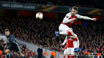 Arsenal's Welsh midfielder Aaron Ramsey scores their third goal with this flick during the UEFA Europa League first leg quarter-final football match between Arsenal and CSKA Moscow at the Emirates Stadium in London on April 5, 2018. / AFP PHOTO / I