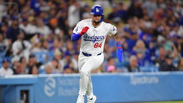 Los Angeles Dodgers center fielder Andy Pages (84) scores a run during his major league debut against the Washington Nationals during the second inning at Dodger Stadium.