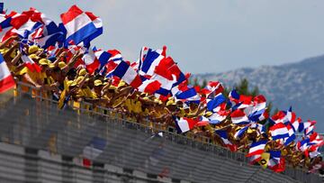 LE CASTELLET, FRANCE - JUNE 24:  Fans wave French flags before the Formula One Grand Prix of France at Circuit Paul Ricard on June 24, 2018 in Le Castellet, France.  (Photo by Charles Coates/Getty Images)