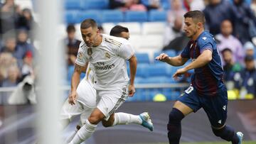 Real Madrid&#039;s Eden Hazard, left, vies for the ball with Levante&#039;s Enis Bardhi during the Spanish La Liga soccer match between Real Madrid and Levante at the Santiago Bernabeu stadium in Madrid, Spain, Saturday, Sept. 14, 2019. (AP Photo/Bernat A