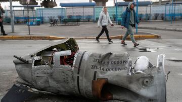 People walk past the remains of a missile at a bus terminal, as Russia's invasion of Ukraine continues, in Kyiv, Ukraine March 4, 2022. REUTERS/Valentyn Ogirenko TPX IMAGES OF THE DAY