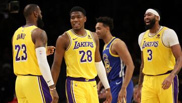 Los Angeles Lakers forward Rui Hachimura (28) smiles with forward LeBron James (23) and forward Anthony Davis (3)