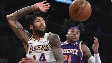 Dec 2, 2018; Los Angeles, CA, USA; Los Angeles Lakers forward Brandon Ingram (14) is fouled by Phoenix Suns guard Jamal Crawford (11) as he drives to the basket during the third quarter at Staples Center. Mandatory Credit: Robert Hanashiro-USA TODAY Sports
