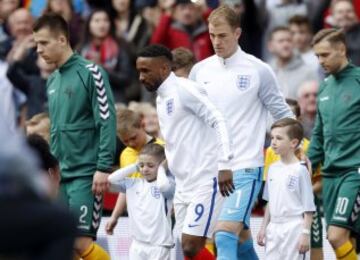 England's Jermain Defoe leads the England team out with mascot Bradley Lowery.