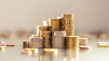 Pile of new euro coins, glowing stacks symbol of wealth and profit. EURO EUROS MONEDA MONEDAS