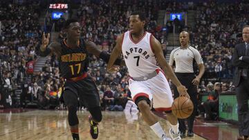 Dec 16, 2016; Toronto, Ontario, CAN; Toronto Raptors guard Kyle Lowry (7) controls a ball as Atlanta Hawks guard Dennis Schroder (17) defends during the first quarter in a game at Air Canada Centre. Mandatory Credit: Nick Turchiaro-USA TODAY Sports