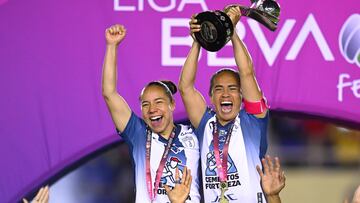 Charlyn Corral and Monica Ocampo of Pachuca lift the championship trophy during the Great-Final second leg match between America and Pachuca as part of the Torneo Clausura 2025, Liga MX Femenil at Ciudad de los Deportes Stadium on May 12, 2025 in Mexico City, Mexico.