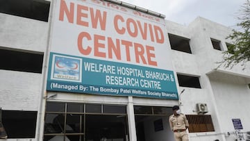 Gujarat Police Personnel stand guard in front of the Patel Welfare Covid Hospital after a fire broke out overnight killing 16 Covid-19 patients including one health worker, in Bharuch some 190 km from Ahmedabad on May 1, 2021. (Photo by SAM PANTHAKY / AFP