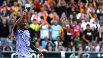 Real Madrid's Brazilian forward Vinicius Junior gestures to the stands during the Spanish league football match between Valencia CF and Real Madrid CF at the Mestalla stadium in Valencia on May 21, 2023. (Photo by JOSE JORDAN / AFP)