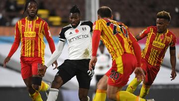 Fulham's Cameroonian midfielder Andre-Frank Zambo Anguissa (2L) vies with West Bromwich Albion's Serbian defender Branislav Ivanovic (2R) during the English Premier League football match between Fulham and West Bromwich Albion at Craven Cottage