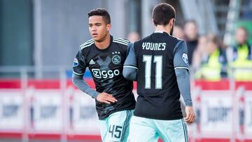 Justin Kluivert (L, 17 years old) of Ajax makes his debut in de the Dutch eredivisie entering the field for injured Amin Younes (R) during the match between Ajax Amsterdam and PEC Zwolle in Zwolle,