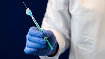 (FILES) In this file photo taken on February 12, 2021 a healthcare worker holds a syringe of the AstraZeneca Covid-19 vaccine at the university hospital in Halle/Saale, eastern Germany, on February 12, 2021, at the start of the inoculation with the vaccine at the hospital. - Germany on on March 15, 2021 halted the use of AstraZeneca's coronavirus vaccine after reported blood clotting incidents in Europe, saying that a closer look was necessary. (Photo by JENS SCHLUETER / AFP)