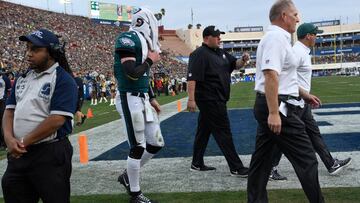 Dec 10, 2017; Los Angeles, CA, USA; Philadelphia Eagles quarterback Carson Wentz (11) is escorted off the field after injuring his knee in the second half of the Eagles 43-35 win over the Los Angeles Rams at Los Angeles Memorial Coliseum. Mandatory Credit: Robert Hanashiro-USA TODAY Sports