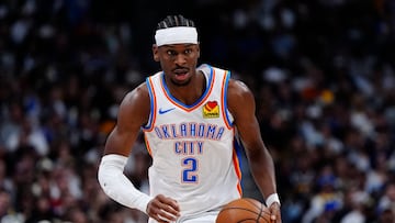 May 9, 2025; Denver, Colorado, USA; Oklahoma City Thunder guard Shai Gilgeous-Alexander (2) controls the ball in the first quarter against the Denver Nuggets during game three of the second round for the 2025 NBA Playoffs at Ball Arena. Mandatory Credit: Ron Chenoy-Imagn Images