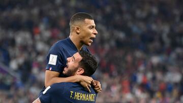 France's forward #10 Kylian Mbappe celebrates with France's defender #22 Theo Hernandez after scoring his team's first goal during the Qatar 2022 World Cup Group D football match between France and Denmark at Stadium 974 in Doha on November 26, 2022. (Photo by FRANCK FIFE / AFP)