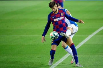 Barcelona's Spanish defender Gerard Pique vies with Espanyol's Spanish forward Victor Campuzano.