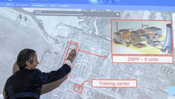 Rafael Grossi, Director General of the International Atomic Energy Agency (IAEA), points on a map of the Ukrainian Zaporizhzhia power plant.