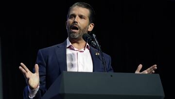 FILE - This June 23, 2020 file photo, Donald Trump Jr. speaks before President Donald Trump arrives to speak to a group of young Republicans at Dream City Church in Phoenix.  Twitter has temporarily halted Trump Jr. from tweeting after he shared a video r