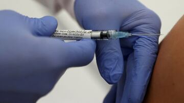 FILE PHOTO: Professor Gottfried Kremsner injects a vaccination against the coronavirus disease (COVID-19) from German biotechnology company CureVac to a volunteer at the start of a clinical test series at his tropical institute of the university clinic in