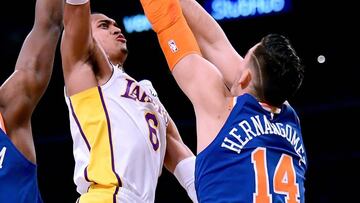 LOS ANGELES, CA - JANUARY 21: Jordan Clarkson #6 of the Los Angeles Lakers scores over Frank Ntilikina #11 and Willy Hernangomez #14 of the New York Knicks during a 127-107 Laker win at Staples Center on January 21, 2018 in Los Angeles, California.   Harry How/Getty Images/AFP
 == FOR NEWSPAPERS, INTERNET, TELCOS &amp; TELEVISION USE ONLY ==