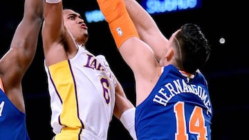 LOS ANGELES, CA - JANUARY 21: Jordan Clarkson #6 of the Los Angeles Lakers scores over Frank Ntilikina #11 and Willy Hernangomez #14 of the New York Knicks during a 127-107 Laker win at Staples Center on January 21, 2018 in Los Angeles, California.   Harry How/Getty Images/AFP
 == FOR NEWSPAPERS, INTERNET, TELCOS &amp; TELEVISION USE ONLY ==