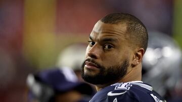 LANDOVER, MARYLAND - JANUARY 08: Quarterback Dak Prescott #4 of the Dallas Cowboys looks on from the bench in the closing moments of the Cowboys loss to the Washington Commanders at FedExField on January 08, 2023 in Landover, Maryland.   Rob Carr/Getty Images/AFP (Photo by Rob Carr / GETTY IMAGES NORTH AMERICA / Getty Images via AFP)