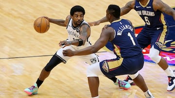 NEW ORLEANS, LOUISIANA - APRIL 20: Kyrie Irving #11 of the Brooklyn Nets drives against Zion Williamson #1 of the New Orleans Pelicans during the first half at the Smoothie King Center on April 20, 2021 in New Orleans, Louisiana. NOTE TO USER: User expressly acknowledges and agrees that, by downloading and or using this Photograph, user is consenting to the terms and conditions of the Getty Images License Agreement.   Jonathan Bachman/Getty Images/AFP
 == FOR NEWSPAPERS, INTERNET, TELCOS &amp; TELEVISION USE ONLY ==