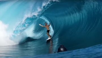 Eimeo Czermak en Teahupo'o abriendo los brazos en una ola gigante en forma de tubo.