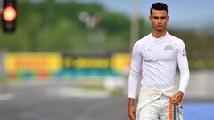 Manor Racing MRT's German driver Pascal Wehrlein walks down the pit lane prior the first training session ahead of the Formula One Hungarian Grand Prix at the Hungaroring circuit near Budapest, on July 22, 2016. / AFP PHOTO / ANDREJ ISAKOVIC