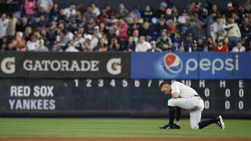 NEW YORK, NY - SEPTEMBER 03: Aaron Judge #99 of the New York Yankees takes a knee before the start of a game against the Boston Red Sox at Yankee Stadium on September 3, 2017 in the Bronx borough of New York City.   Rich Schultz/Getty Images/AFP
 == FOR NEWSPAPERS, INTERNET, TELCOS &amp; TELEVISION USE ONLY ==