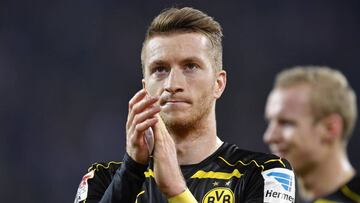 Dortmund's Marco Reus claps hands disappointed to supporters after the German Bundesliga soccer match between 1. FC Cologne and Borussia Dortmund in Cologne, Germany, Saturday, Dec. 10, 2016. The match ended 1-1. (AP Photo/Martin Meissner)