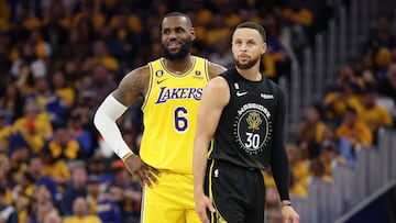 SAN FRANCISCO, CALIFORNIA - MAY 02: LeBron James #6 of the Los Angeles Lakers stands next to Stephen Curry #30 of the Golden State Warriors during the second quarter in game one of the Western Conference Semifinal Playoffs at Chase Center on May 02, 2023 in San Francisco, California. NOTE TO USER: User expressly acknowledges and agrees that, by downloading and or using this photograph, User is consenting to the terms and conditions of the Getty Images License Agreement.   Ezra Shaw/Getty Images/AFP (Photo by EZRA SHAW / GETTY IMAGES NORTH AMERICA / Getty Images via AFP)