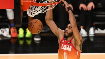 Boston Celtics' Jayson Tatum dunks the ball during the NBA All-Star game.