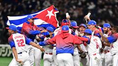 Members of Cuba's team celebrate their 4-3 victory in the World Baseball Classic (WBC) quarter-final game between Cuba and Australia at the Tokyo Dome in Tokyo on March 15, 2023. (Photo by Philip FONG / AFP)