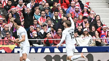 Valencia's Argentinian forward # 15 Lucas Beltran celebrates scoring his team's first goal during the Spanish league football match between Club Atletico de Madrid and Valencia CF at Metropolitano Stadium in Madrid on December 13, 2025. (Photo by Javier SORIANO / AFP)