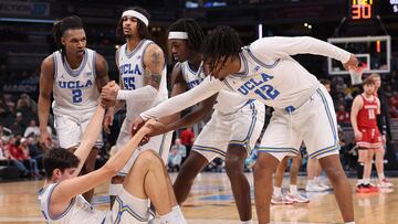 INDIANAPOLIS, INDIANA - MARCH 14: Aday Mara #15 of the UCLA Bruins is helped up off the court against the Wisconsin Badgers during the second half in the Big Ten men's basketball tournament quarterfinals at Gainbridge Fieldhouse on March 14, 2025 in Indianapolis, Indiana. Michael Reaves/Getty Images/AFP (Photo by Michael Reaves / GETTY IMAGES NORTH AMERICA / Getty Images via AFP)