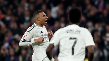Soccer Football - LaLiga - Real Madrid v Atletico Madrid - Santiago Bernabeu, Madrid, Spain - February 8, 2025 Real Madrid's Kylian Mbappe celebrates with Vinicius Junior after scoring their first goal REUTERS/Violeta Santos Moura