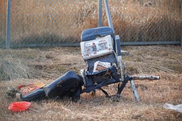 The wreckage of an aircraft lies on the ground after it went off the runway and crashed at Muan International Airport.