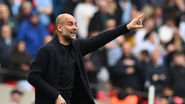 Manchester City's Spanish manager Pep Guardiola gestures on the touchline during the English FA Cup semi-final football match between Manchester City and Chelsea at Wembley Stadium in north west London on April 20, 2024. (Photo by Glyn KIRK / AFP) / NOT FOR MARKETING OR ADVERTISING USE / RESTRICTED TO EDITORIAL USE